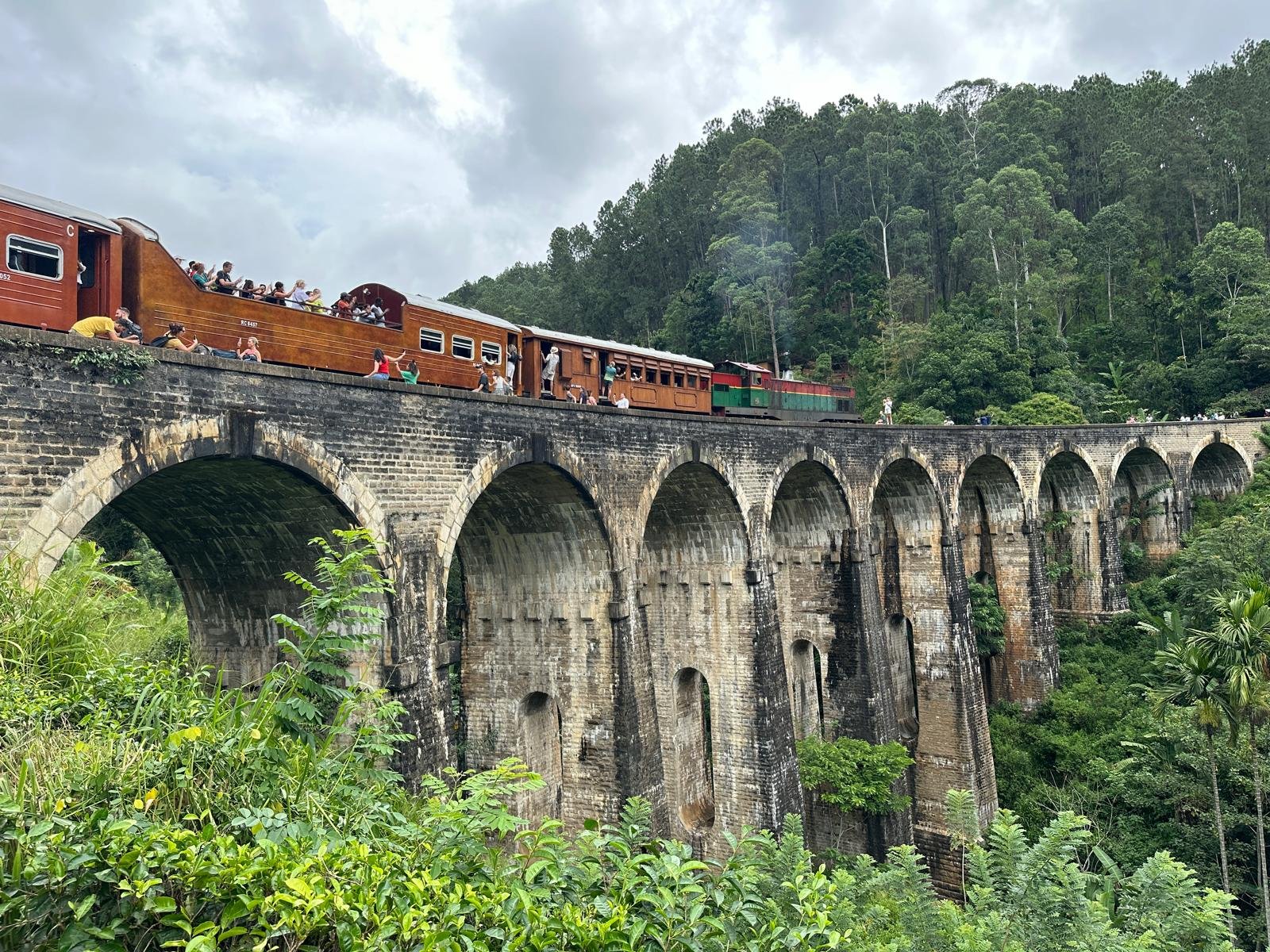 The famous Nine Arch Bridge amidst lush Ella greenery on a Rainbow Tour, Breathtaking panoramic view from the top of Ella Rock after a guided hike, Ella biodiversity and nature, Little Adam's Peak hike, Hiking in Ella